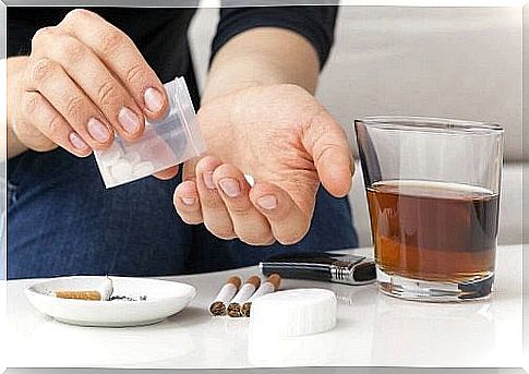 Man with alcohol and cigarettes and pills