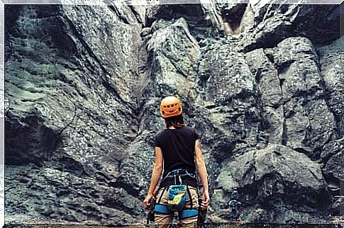 Woman climbing in the mountains