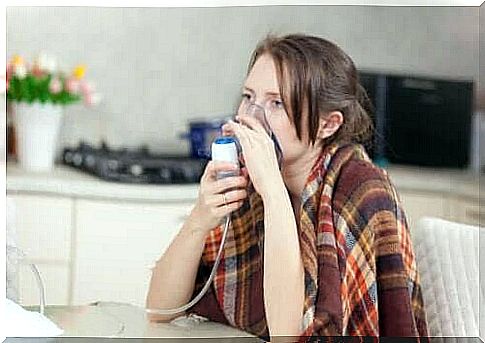 A woman using a respirator