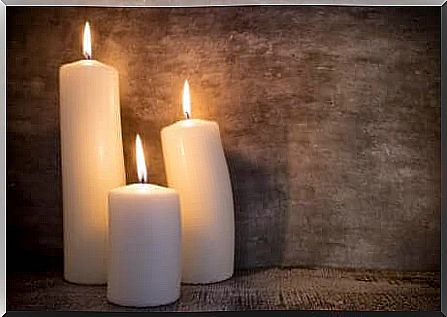 3 white candles burning