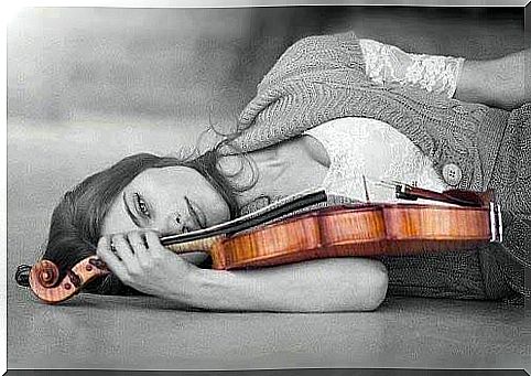 Woman in black and white with violin in color