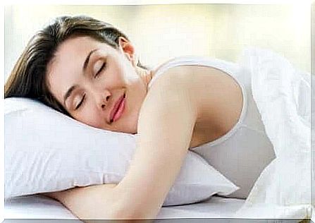 How to get a good night's sleep: woman sleeping peacefully on a pillow