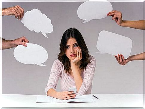 Woman surrounded by speech bubbles