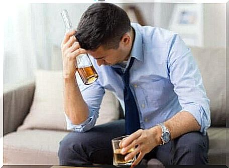 A man who drinks alcohol and feels stressed.